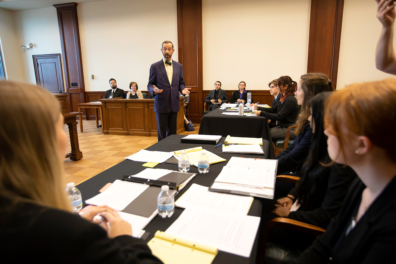 Judge D. P. Marshall Jr. talking with students before mock trial